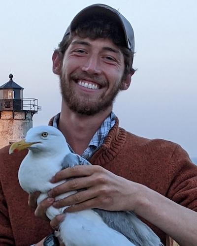 Liam Taylor holding a seagull